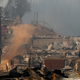 Wreckage of homes destroyed by fire in Santa Olga, Chile, on January 26th, 2017. While the entire town was consumed in the flames, the 6,000 residents reportedly escaped unharmed. Image: Javier Torres/Aton via AP